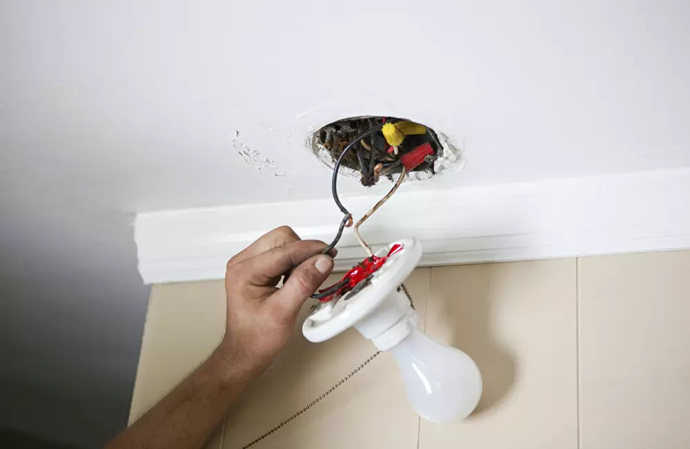 electrician-at-work-installing-a-light-fixture-2026-03-09-01-55-13-utc